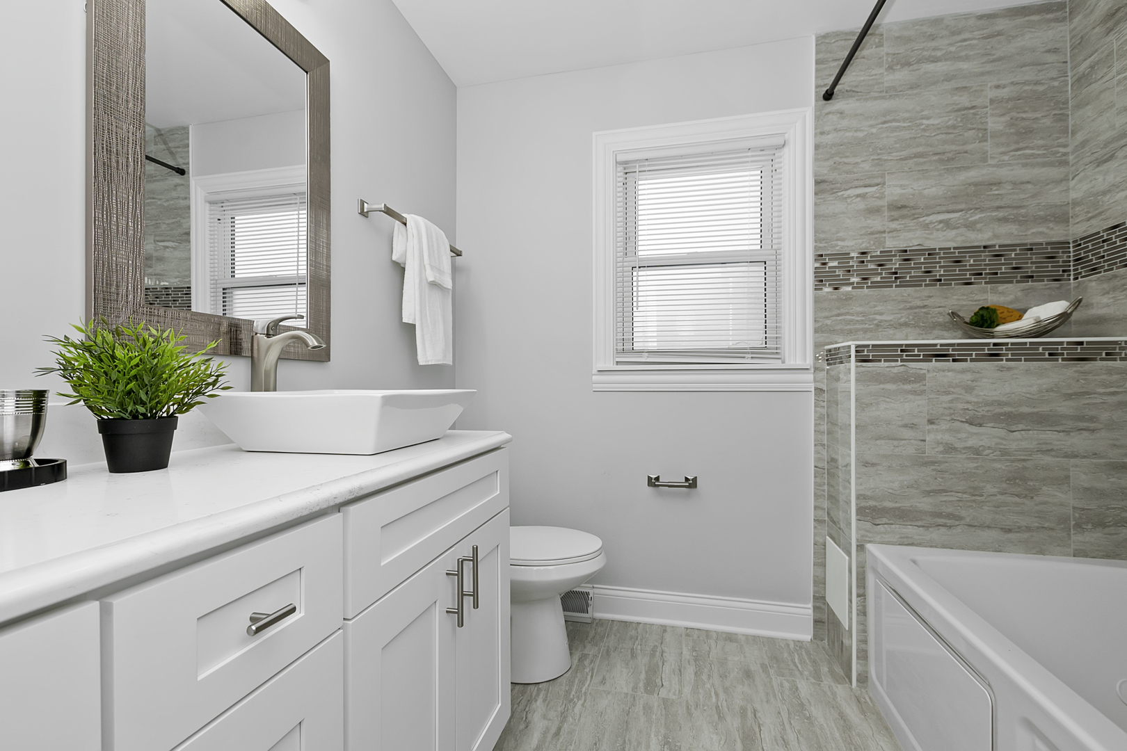 2907 Willow Road Homewood, IL 60430 - Photo 7 of 21 a bathroom with a granite countertop sink a toilet and shower