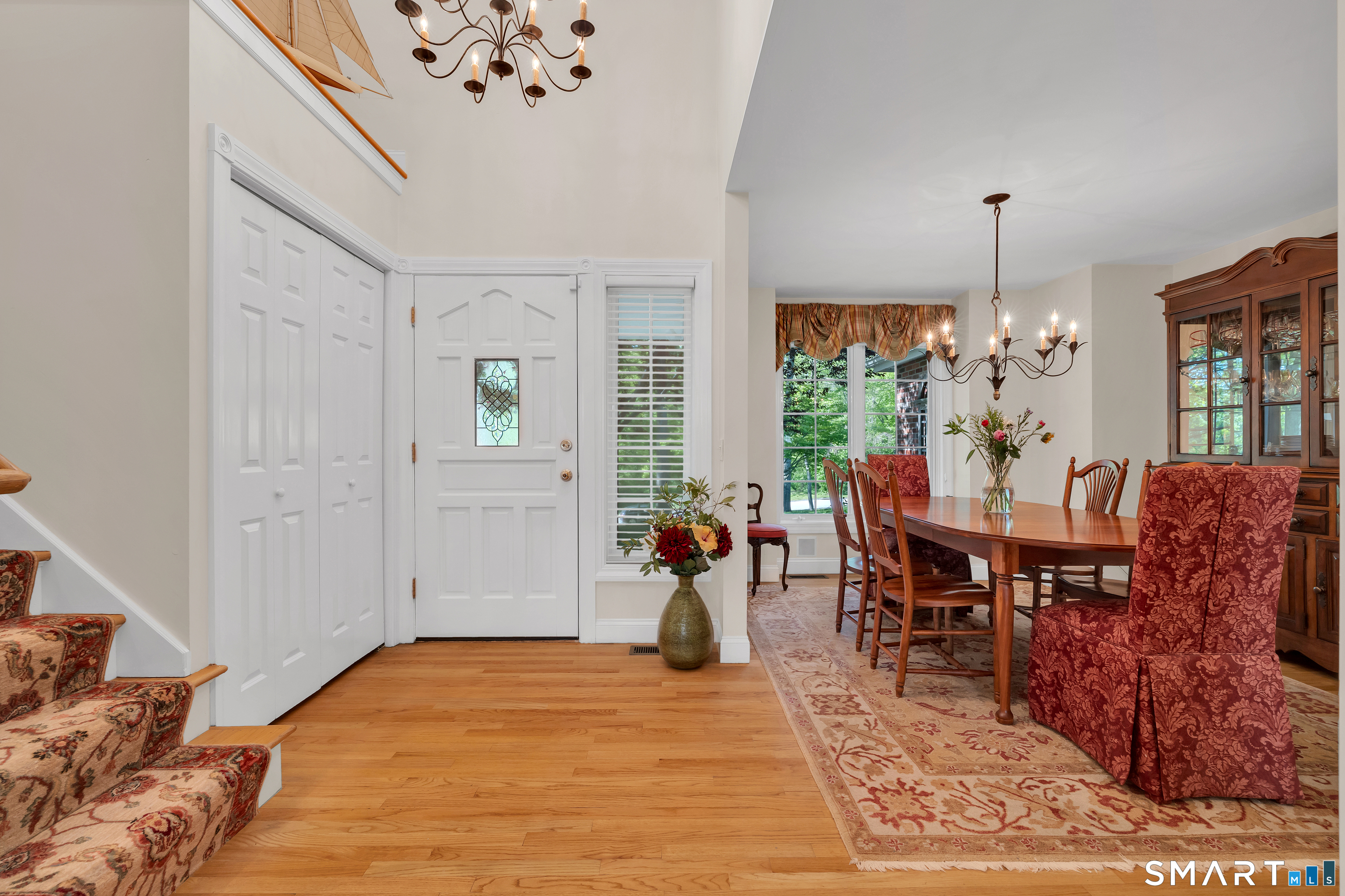 21 Stone Wall Road Salem, CT 06420 - Photo 4 of 38 a living room with furniture dining table and a chandelier