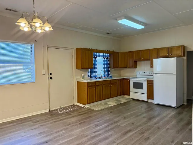 a kitchen with stainless steel appliances a refrigerator and a stove