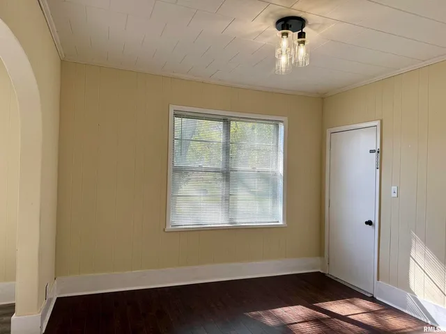 a view of room with window and hardwood floor