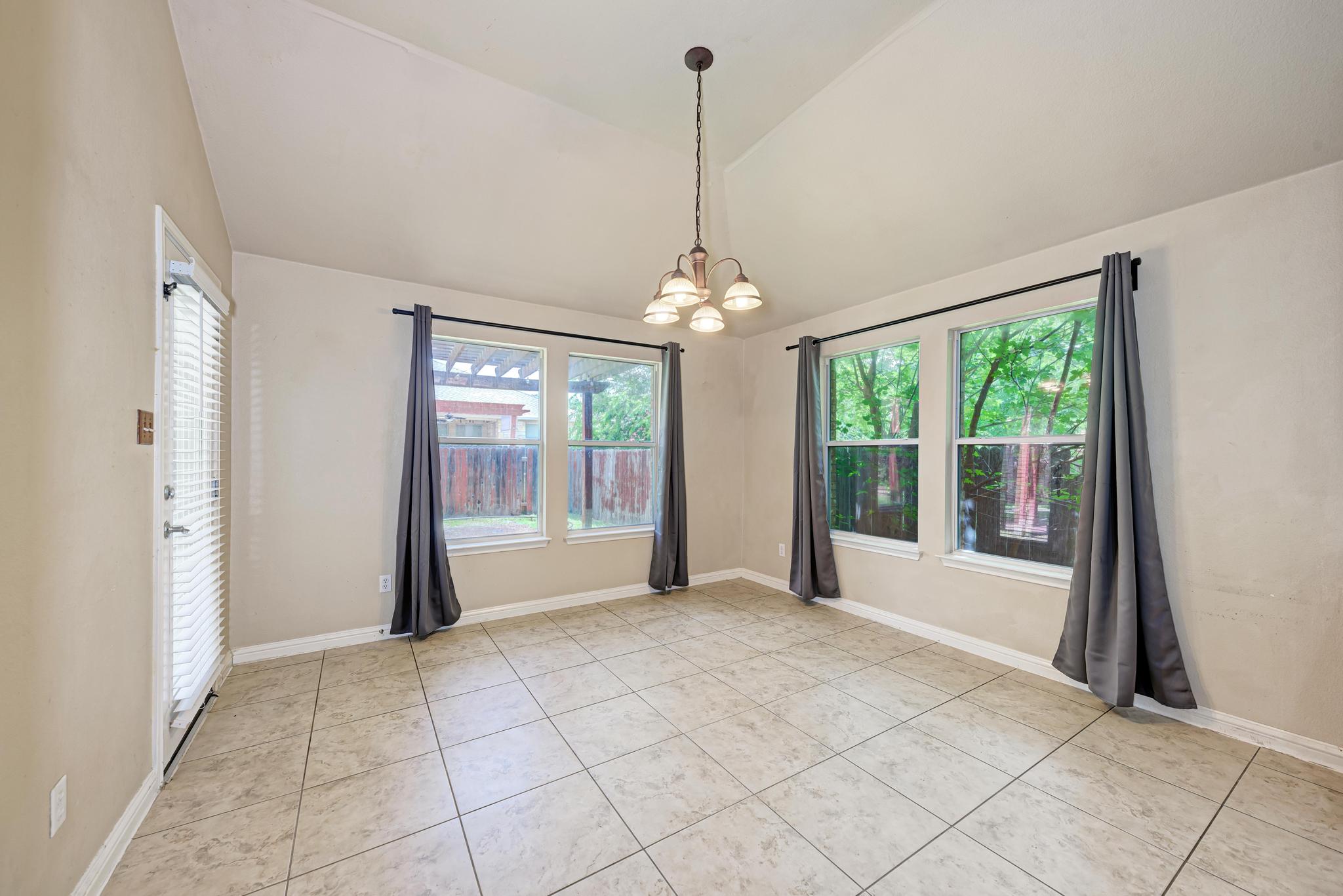18308 Shallow Pool Drive Pflugerville, TX 78660 - Photo 15 of 40 Breakfast nook with views of the backyard.