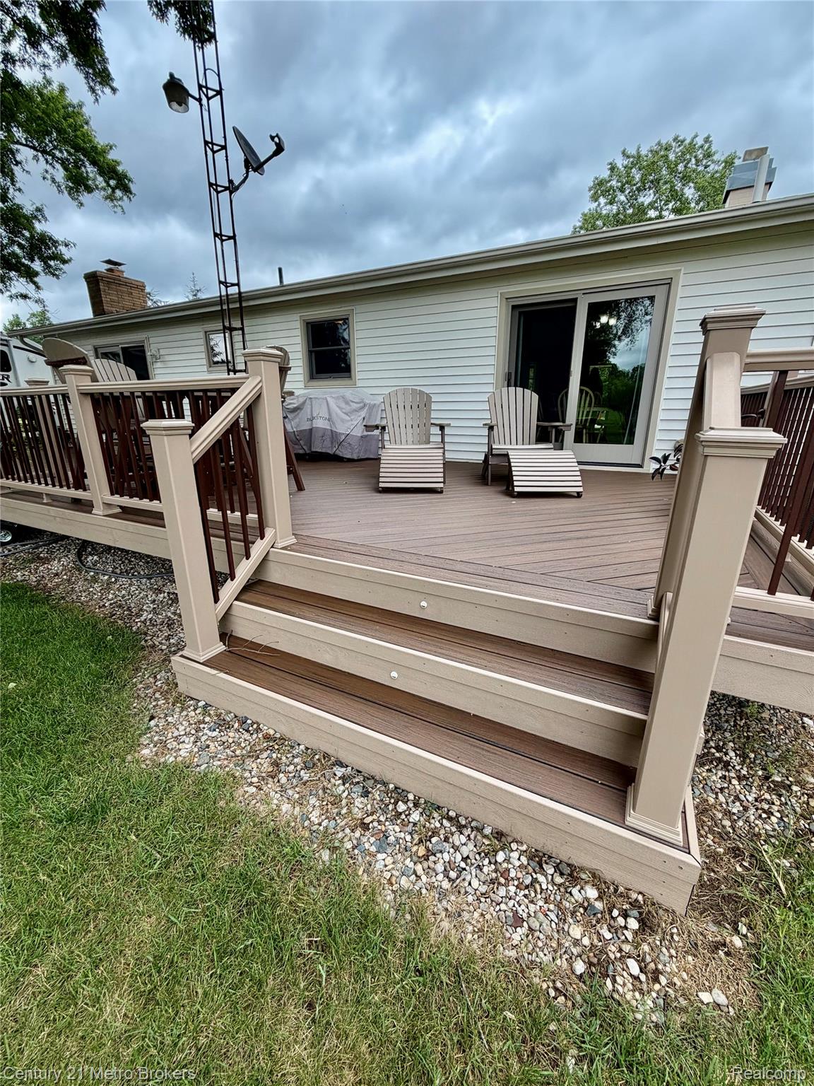 3259 North Seymour Road Flushing, MI 48433 - Photo 10 of 49 Multi-level deck featuring composite decking, integrated stair lighting, and a neutral railing system