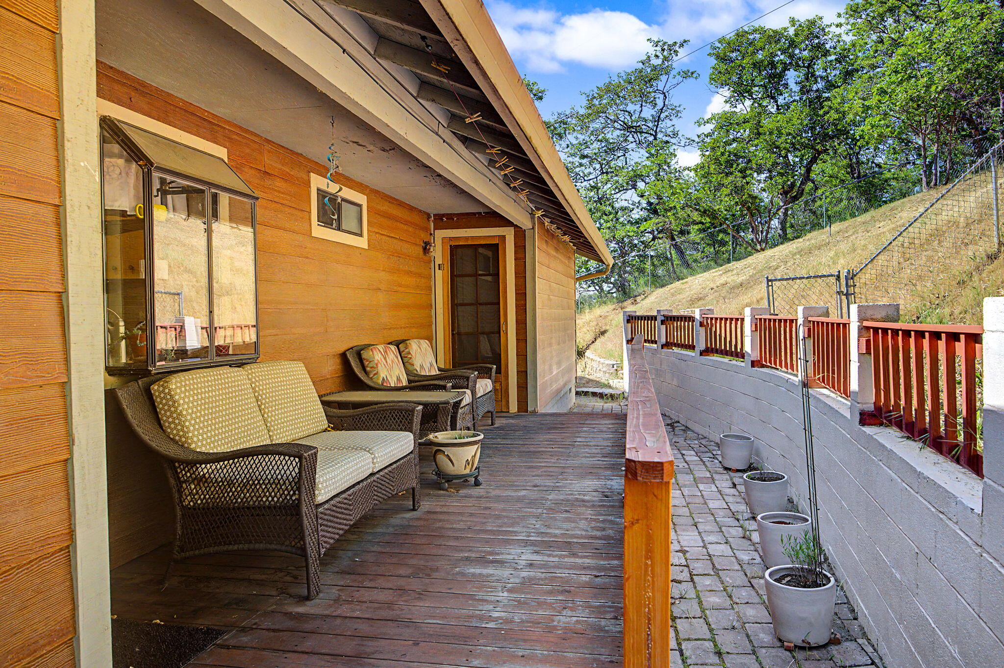 5366 Pioneer Road Medford, OR 97501 - Photo 15 of 36 Back Porch looking to the top of the property of main house