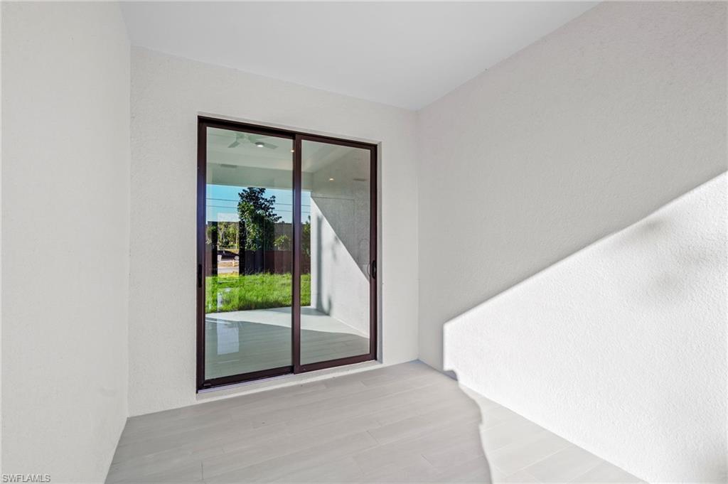 2064 55th Terrace Southwest Naples, FL 34116 - Photo 12 of 30 Property entrance featuring stucco siding