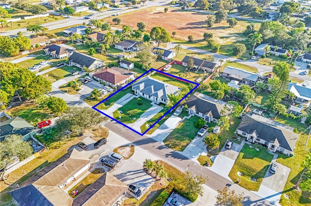 2064 55th Terrace Southwest Naples, FL 34116 - Photo 29 of 30 Aerial view of residential area featuring property parcel outlined