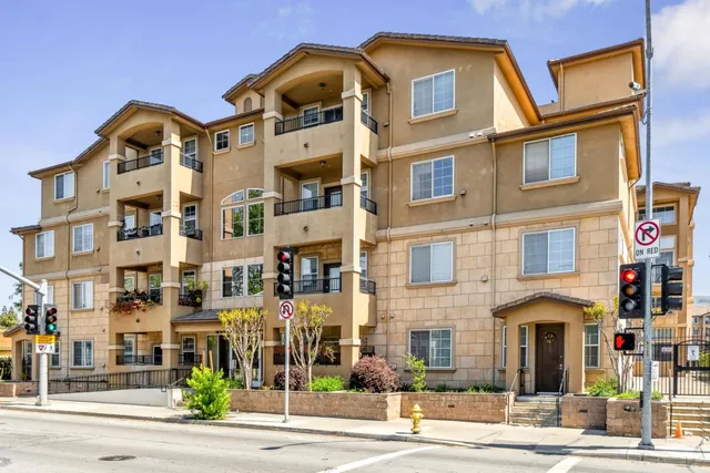 a front view of a multi story residential apartment building