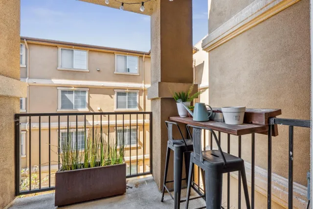 a view of balcony with furniture