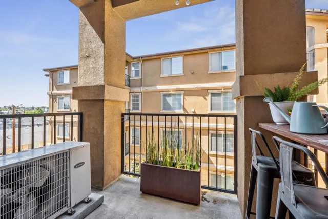 a view of a blue house with a sink and a window