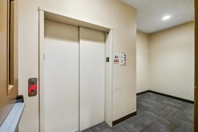 a view of a building with sitting area