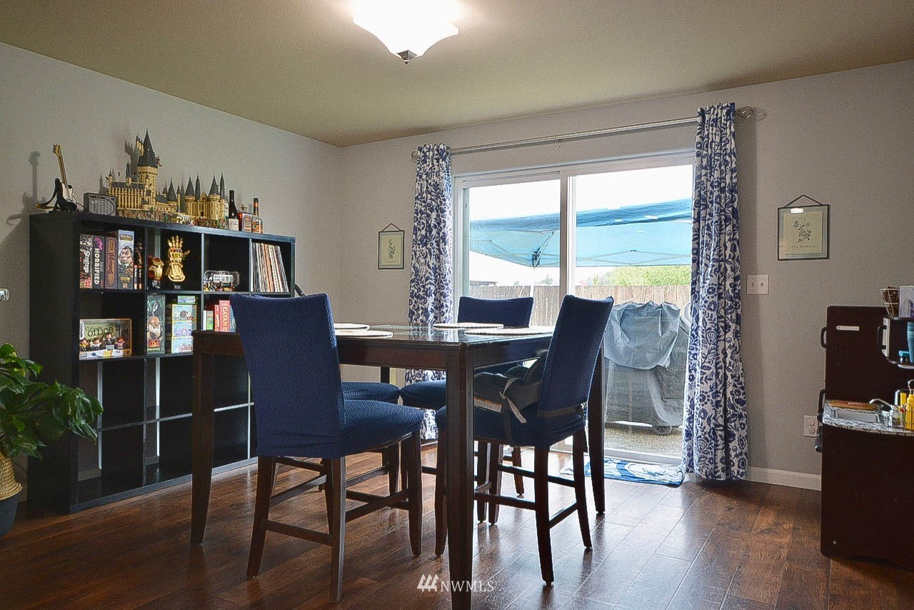 6502 197th Court Southwest Rochester, WA 98579 - Photo 14 of 29 a view of a dining room with furniture window and wooden floor