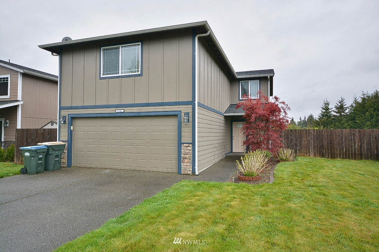 6502 197th Court Southwest Rochester, WA 98579 - Photo 2 of 29 a front view of house with yard and seating area