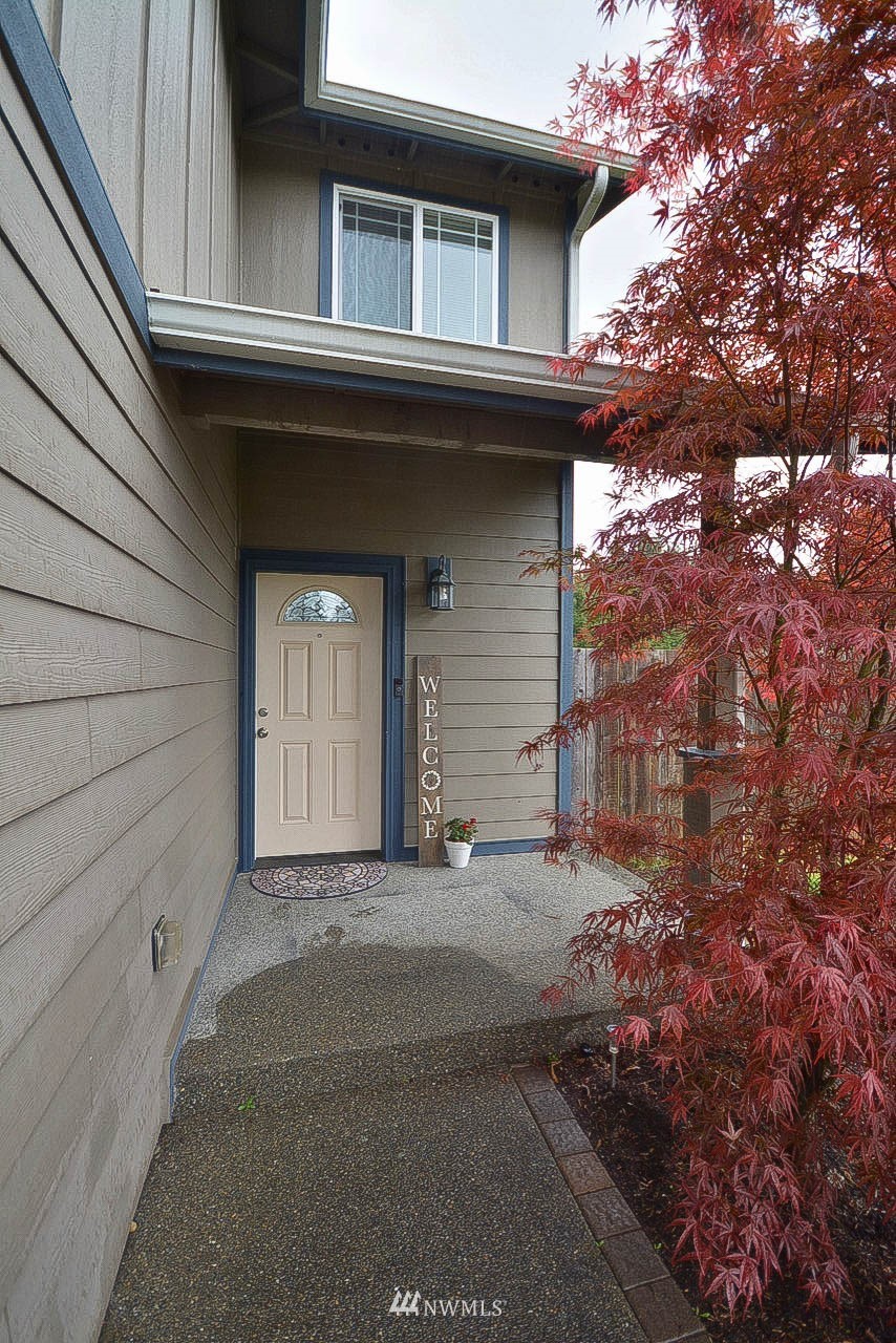 6502 197th Court Southwest Rochester, WA 98579 - Photo 3 of 29 a front view of a house with a garage