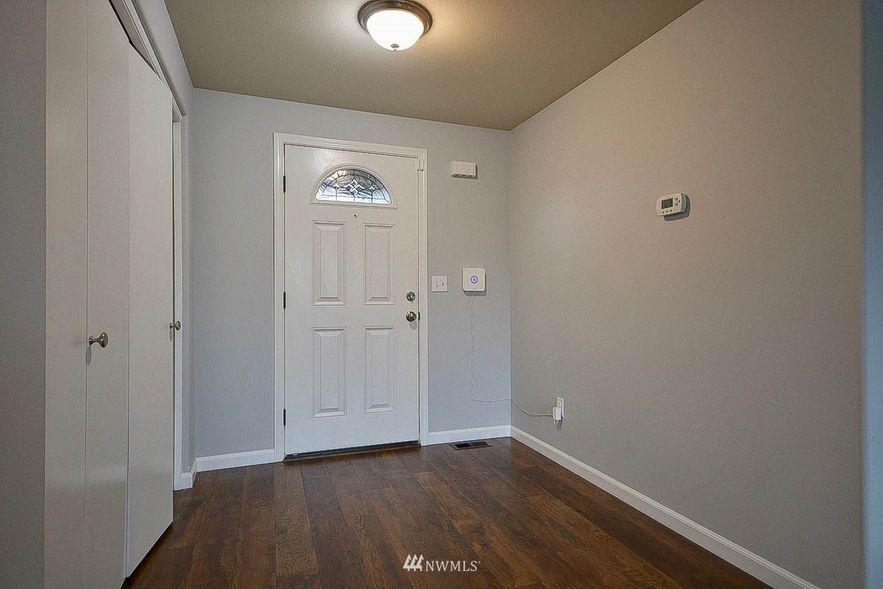 6502 197th Court Southwest Rochester, WA 98579 - Photo 5 of 29 a view of an empty room and wooden floor