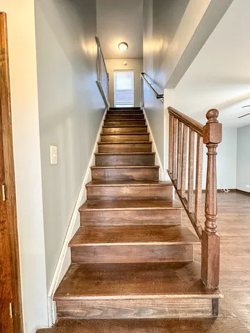 a view of wooden floor and a window in an empty room