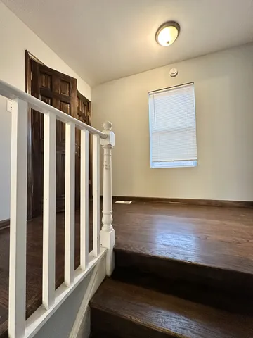 a view of an entryway with wooden floor