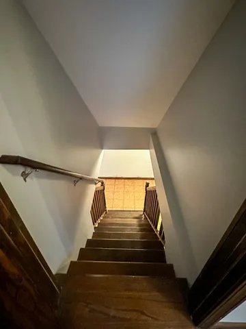 a view of an empty room and a window