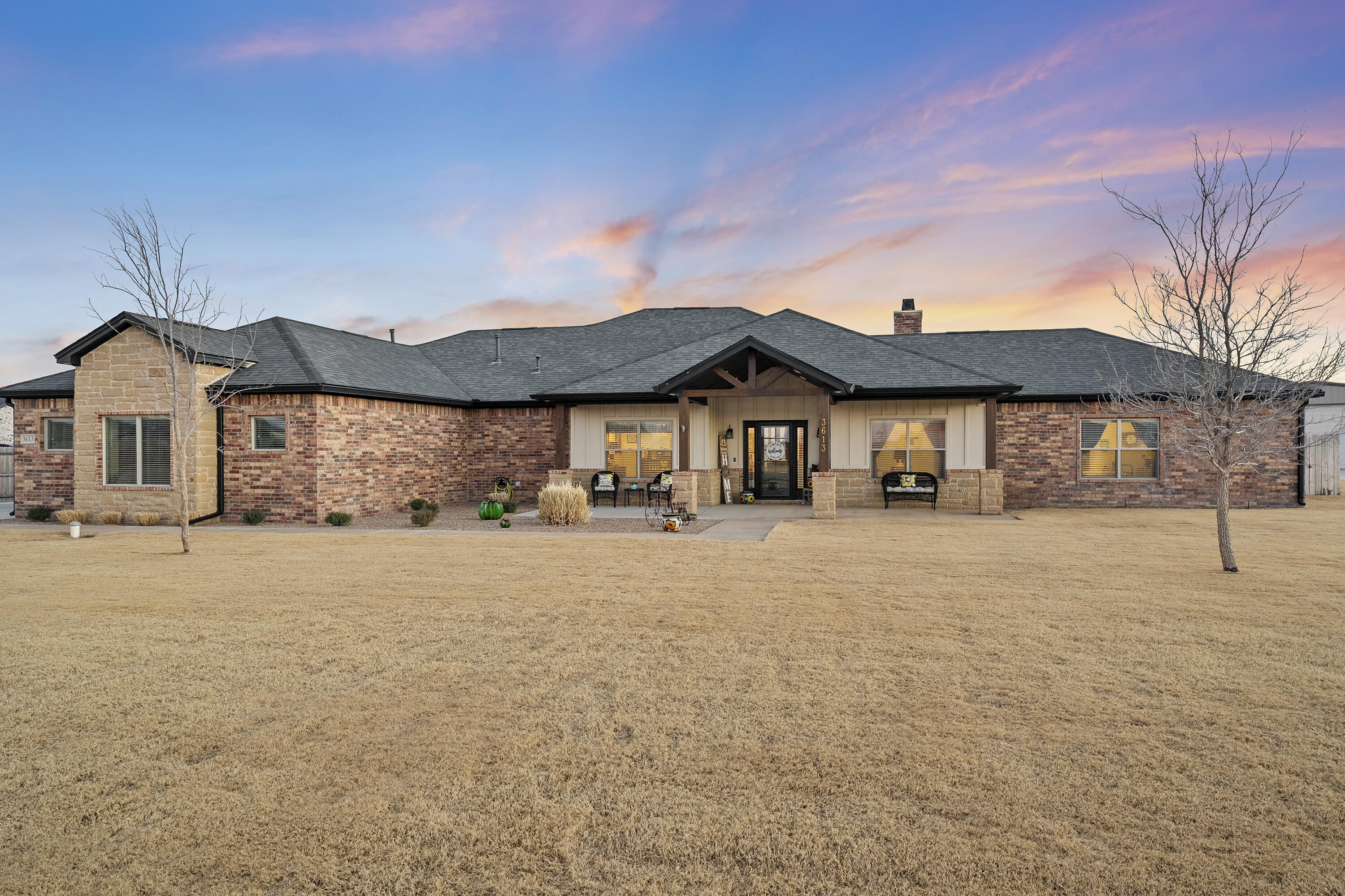 3613 County Road 7660 Lubbock, TX 79423 - Photo 1 of 41 a front view of a house with a yard and garage