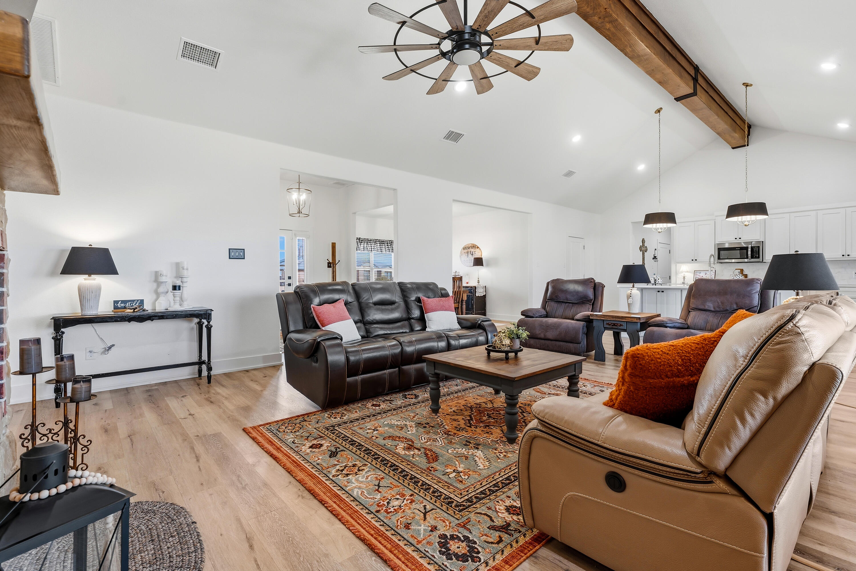 3613 County Road 7660 Lubbock, TX 79423 - Photo 11 of 41 a living room with furniture a rug and white walls