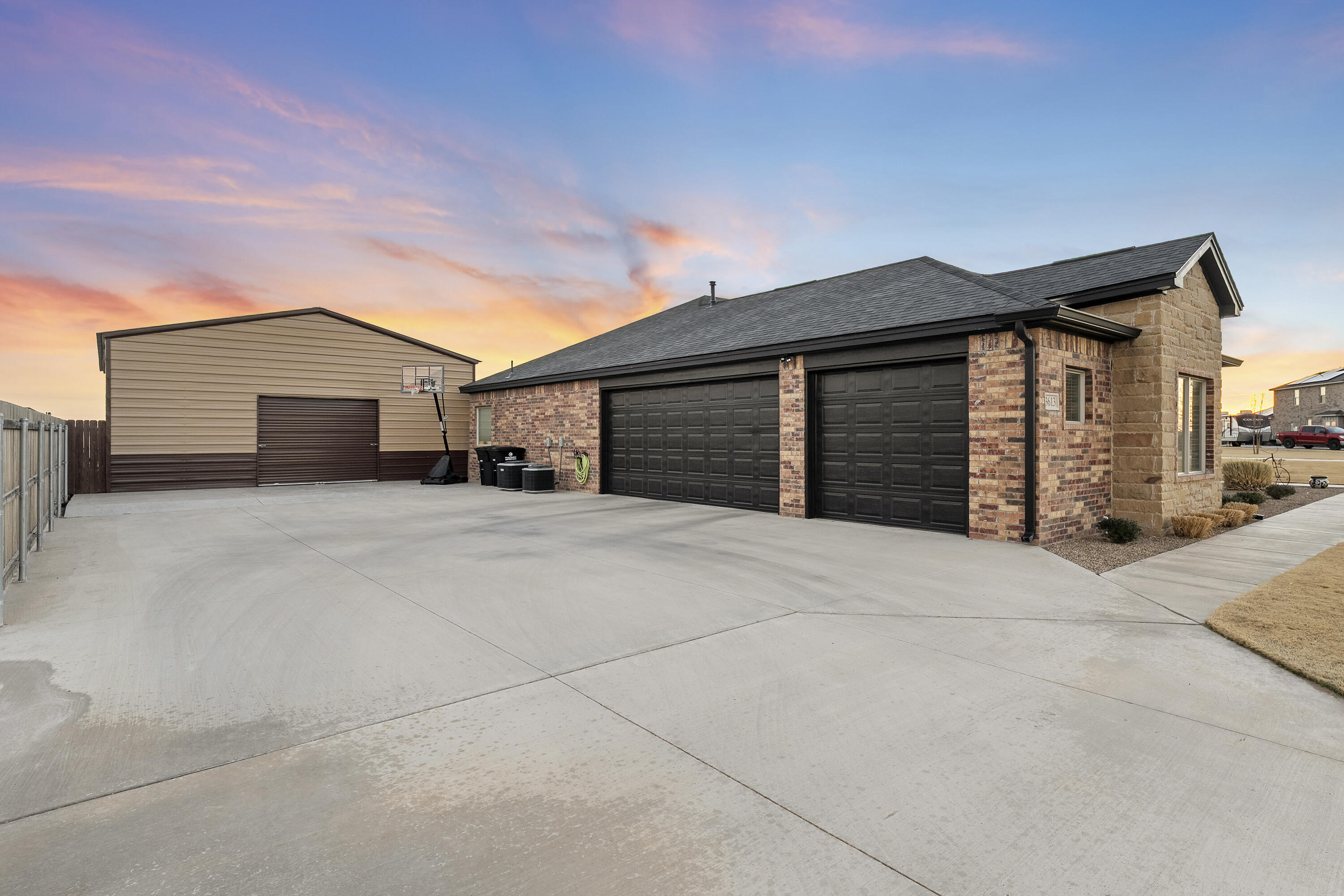 3613 County Road 7660 Lubbock, TX 79423 - Photo 2 of 41 a front view of a house with a garage and a garage