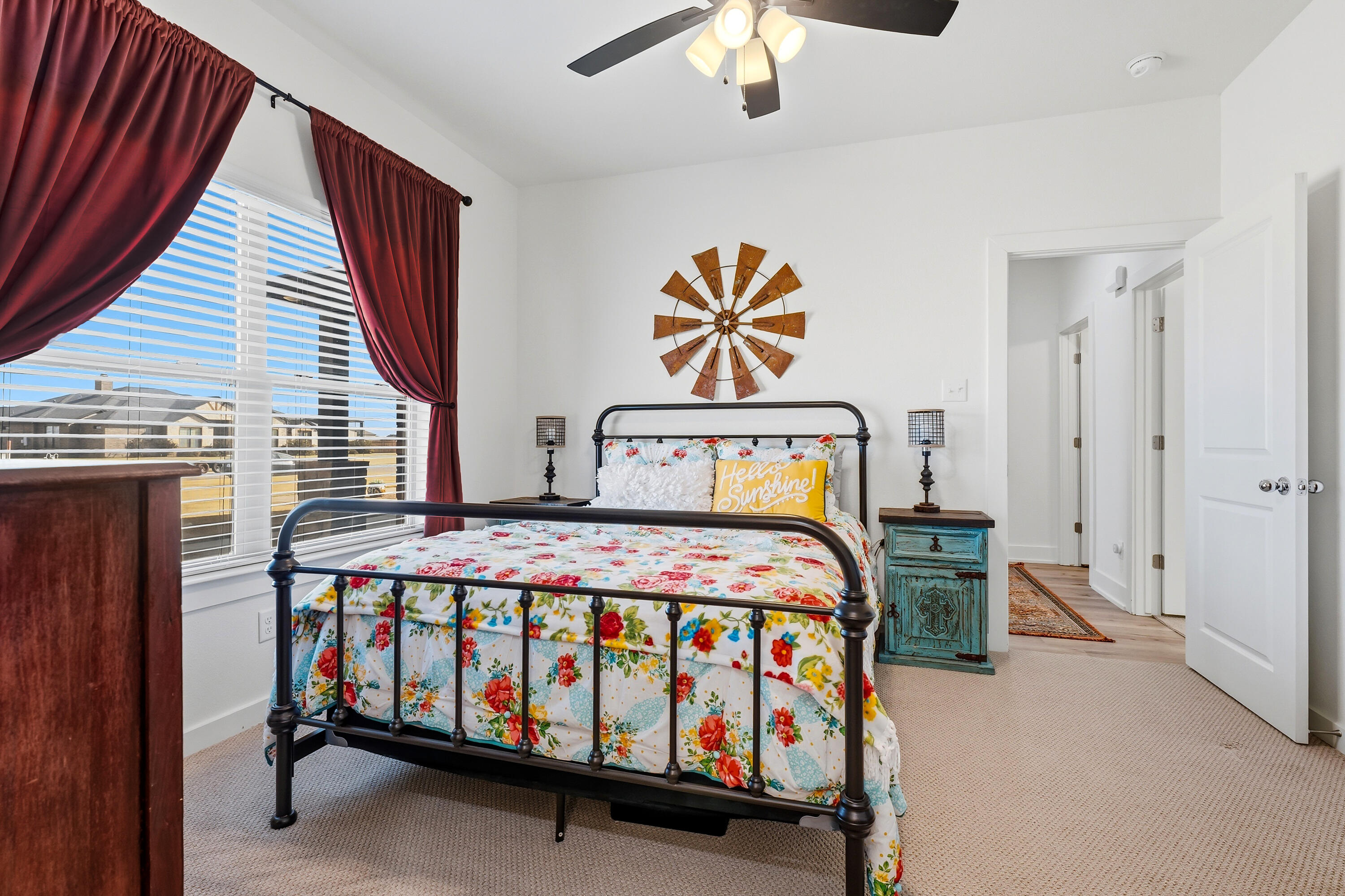 3613 County Road 7660 Lubbock, TX 79423 - Photo 22 of 41 a bedroom with a bed and a chandelier