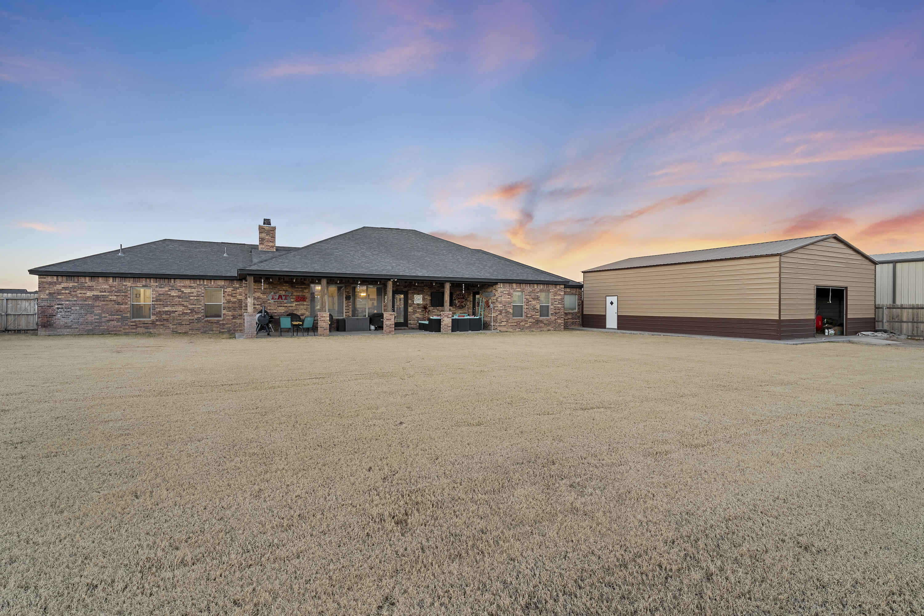 3613 County Road 7660 Lubbock, TX 79423 - Photo 36 of 41 a front view of a house with large windows
