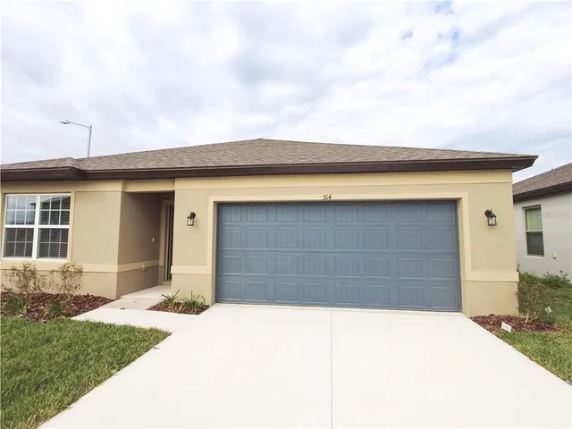 a front view of a house with a garage