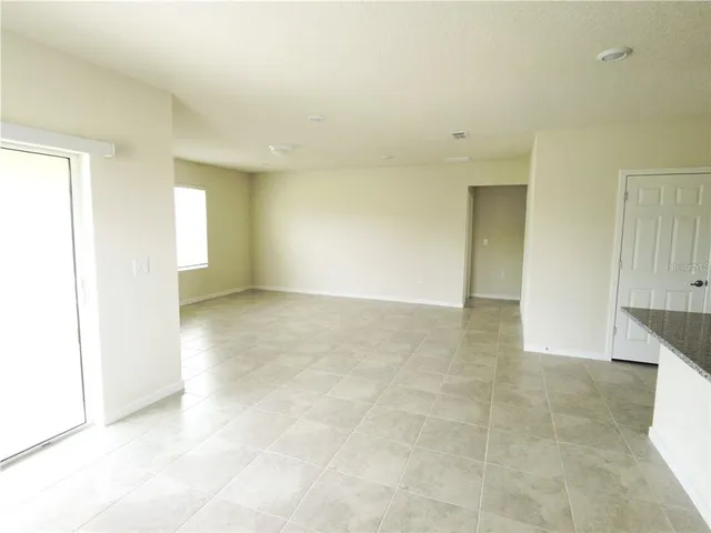 an empty room with a bathroom