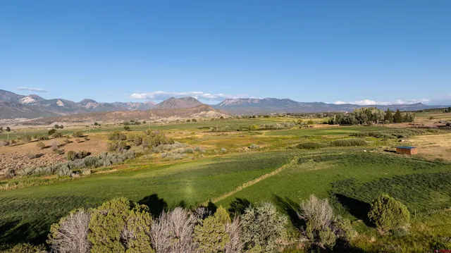 a view of an ocean and a mountain