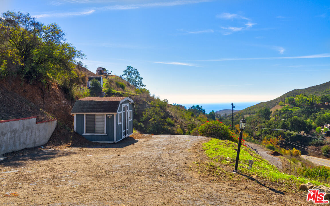 3450 Decker Road Malibu, CA 90265 - Photo 11 of 21 a view of a house with wooden fence