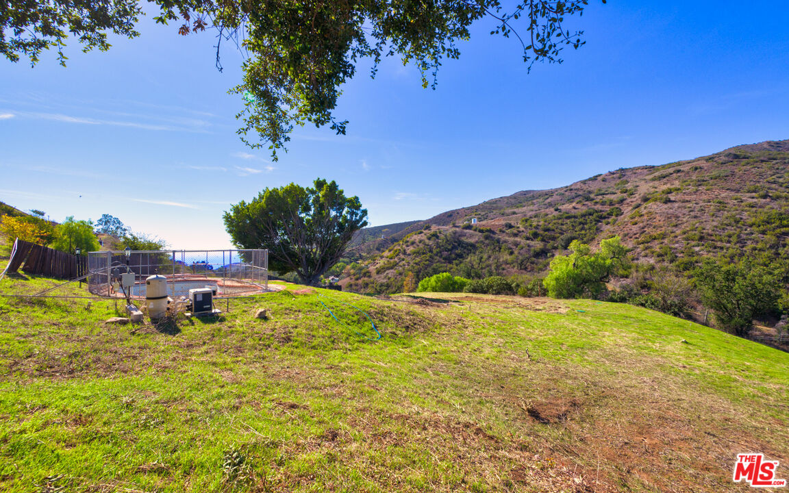 3450 Decker Road Malibu, CA 90265 - Photo 15 of 21 a view of a lake with a mountain in the background