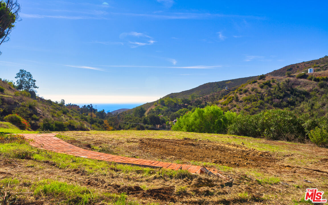 3450 Decker Road Malibu, CA 90265 - Photo 16 of 21 a view of a field with an ocean