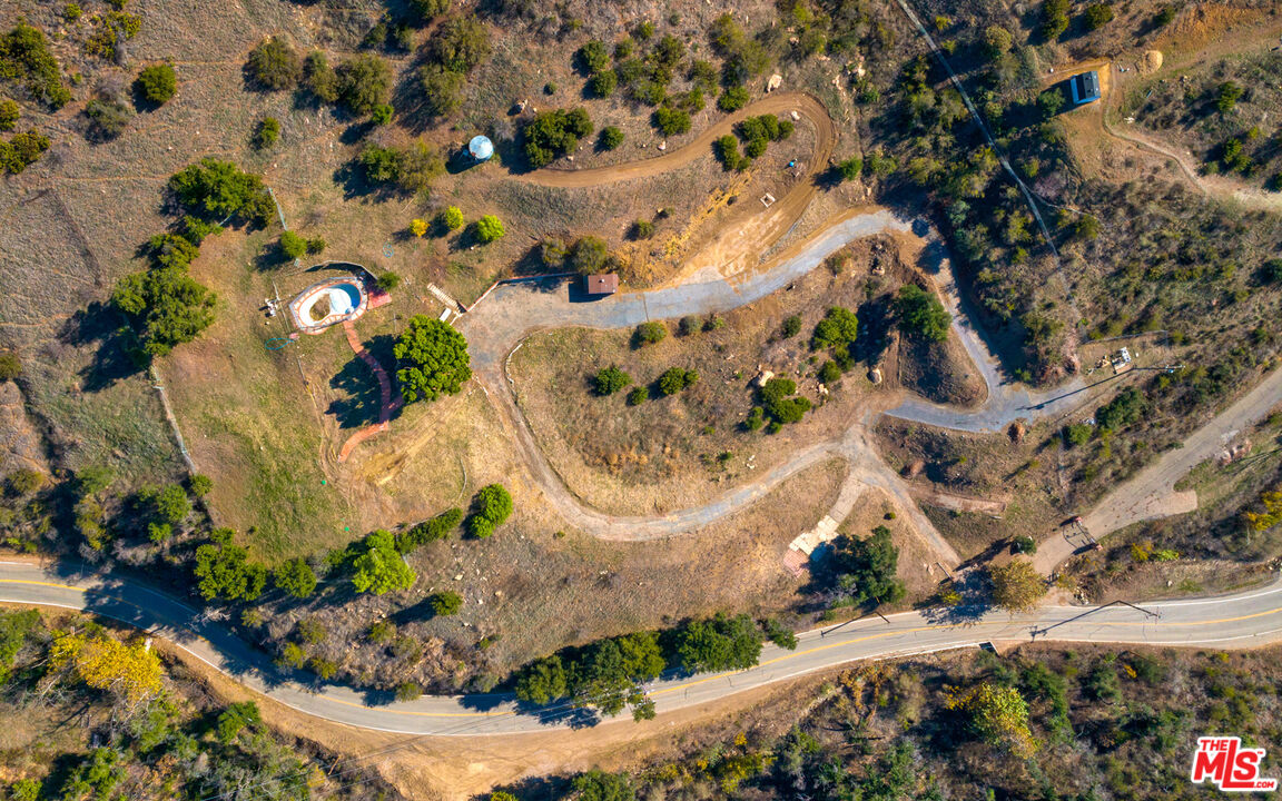 3450 Decker Road Malibu, CA 90265 - Photo 21 of 21 an aerial view of a house with a lot of trees all around