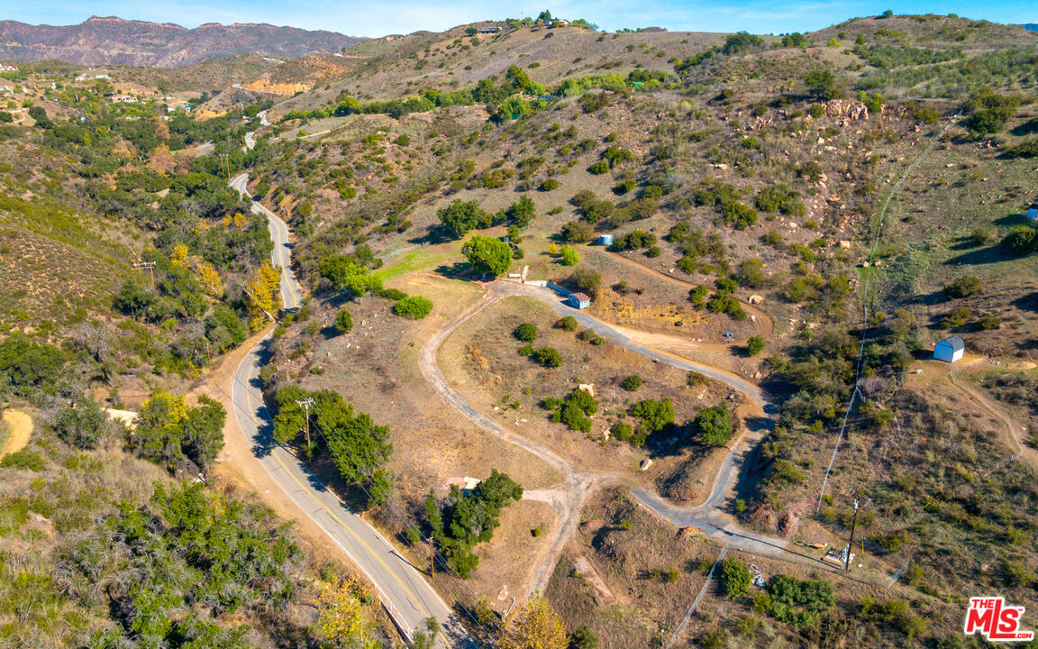 3450 Decker Road Malibu, CA 90265 - Photo 8 of 21 an aerial view of residential house with yard and mountain view in back