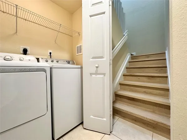 a utility room with dryer and washer