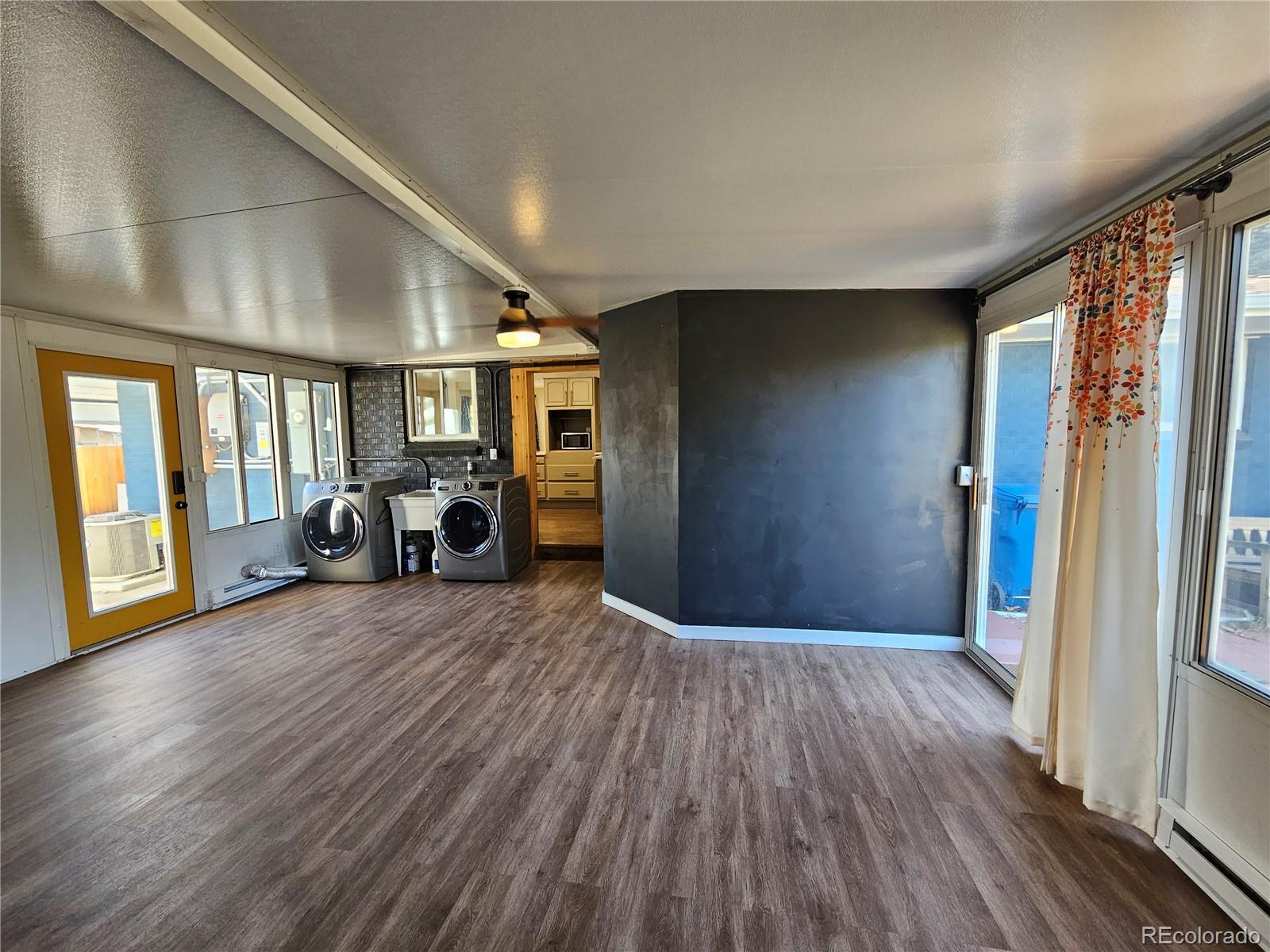 7770 South Kit Carson Drive Centennial, CO 80122 - Photo 11 of 30 a view of livingroom with furniture and staircase