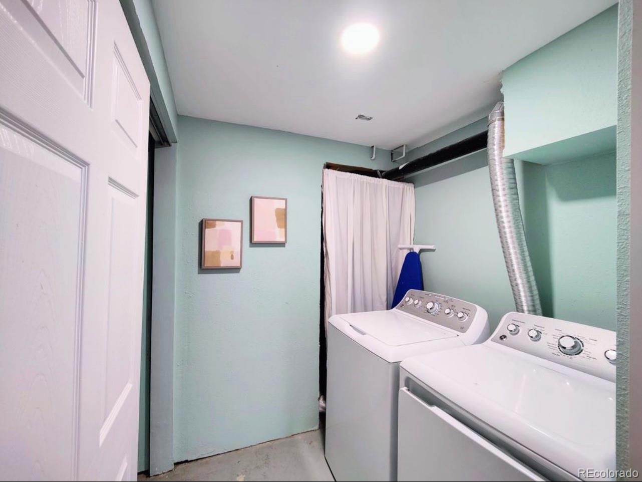 7770 South Kit Carson Drive Centennial, CO 80122 - Photo 17 of 30 a view of storage and utility room with washer and dryer