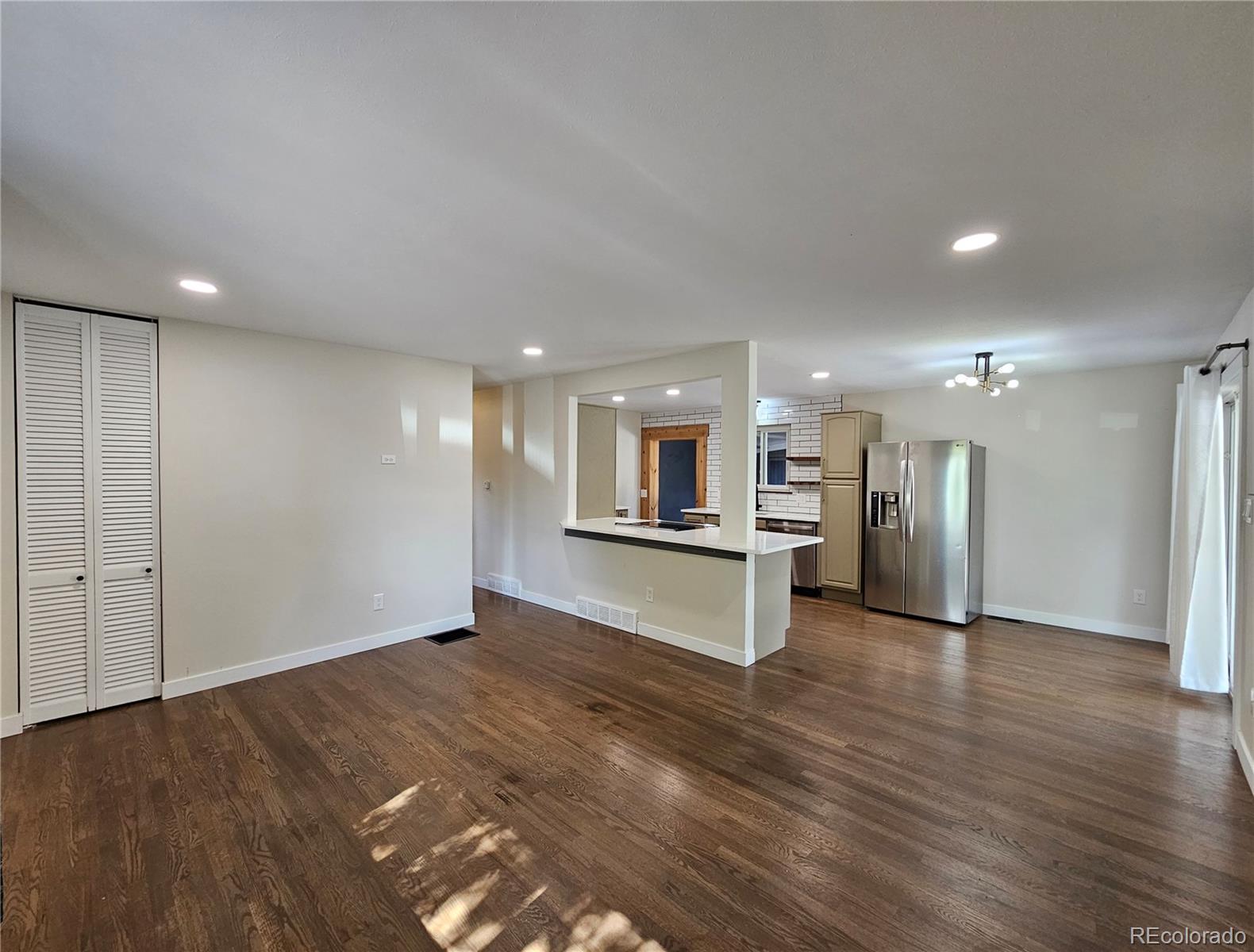 7770 South Kit Carson Drive Centennial, CO 80122 - Photo 6 of 30 a view of kitchen with refrigerator and window