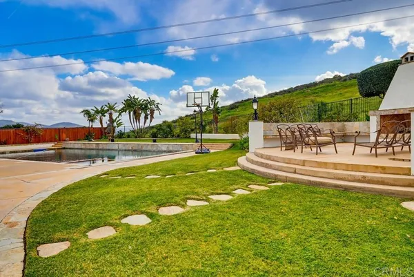 a view of a swimming pool with a garden