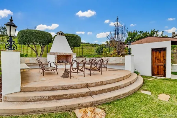 a view of a house with backyard porch and patio