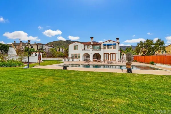 a view of a house with a yard porch and sitting area