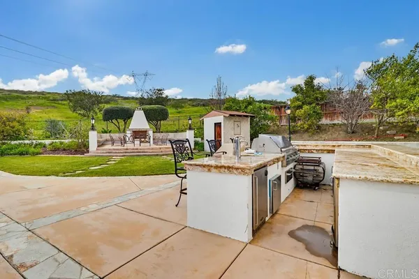 a view of a patio with swimming pool