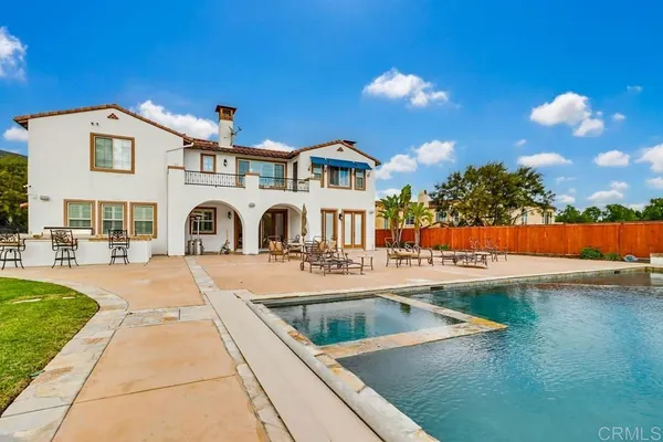 a view of a house with swimming pool