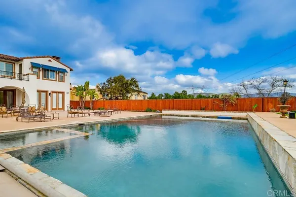 a view of an swimming pool and an outdoor seating