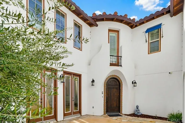a view of a house with a door and windows