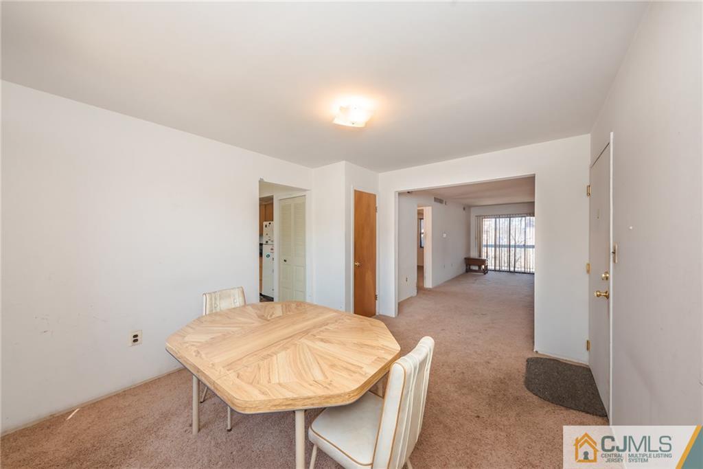 1915 Raspberry Court, Unit 1915 Edison, NJ 08817 - Photo 5 of 18 a room with a table and chairs