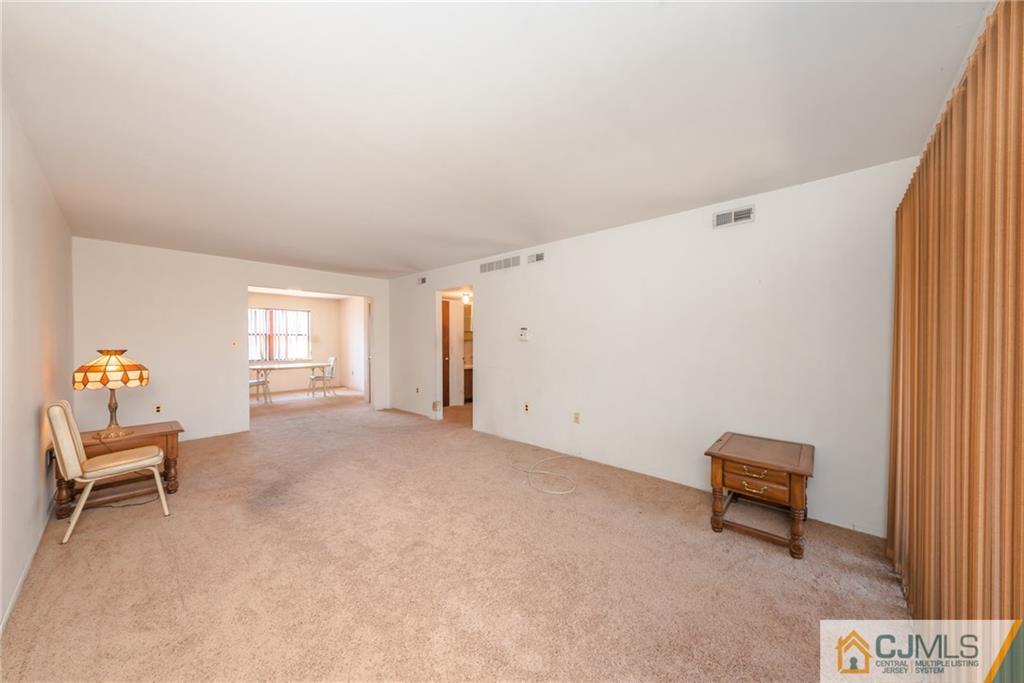 1915 Raspberry Court, Unit 1915 Edison, NJ 08817 - Photo 7 of 18 a living room with furniture and a window