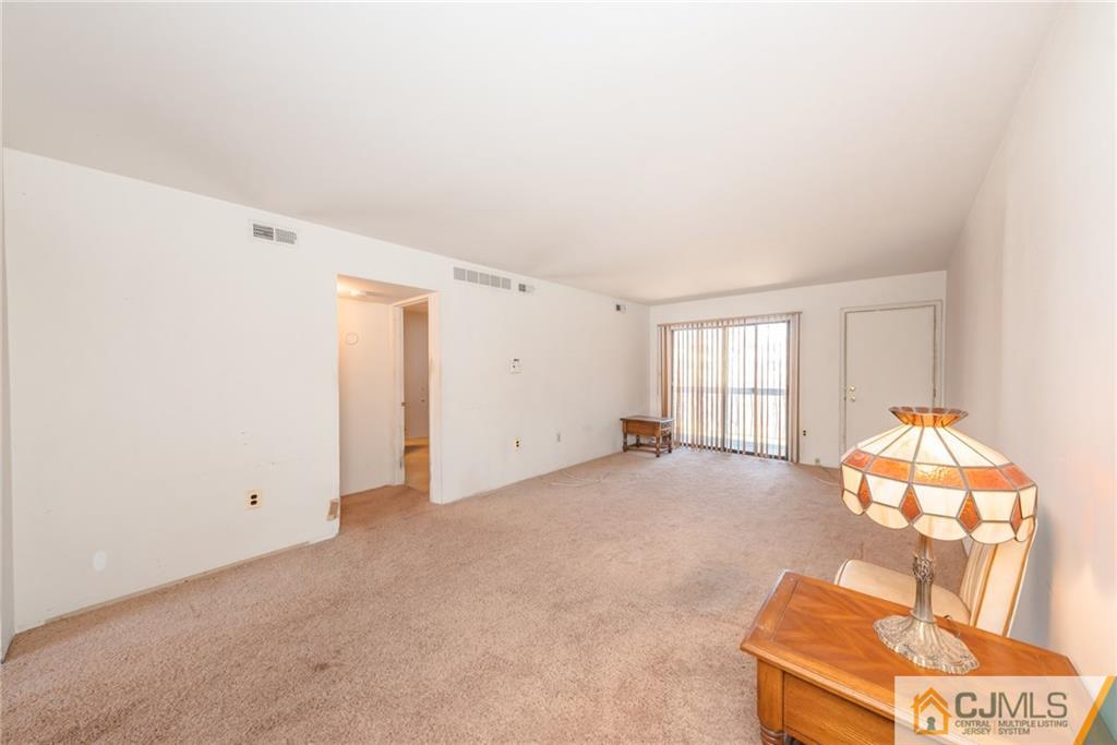 1915 Raspberry Court, Unit 1915 Edison, NJ 08817 - Photo 8 of 18 an empty room with windows