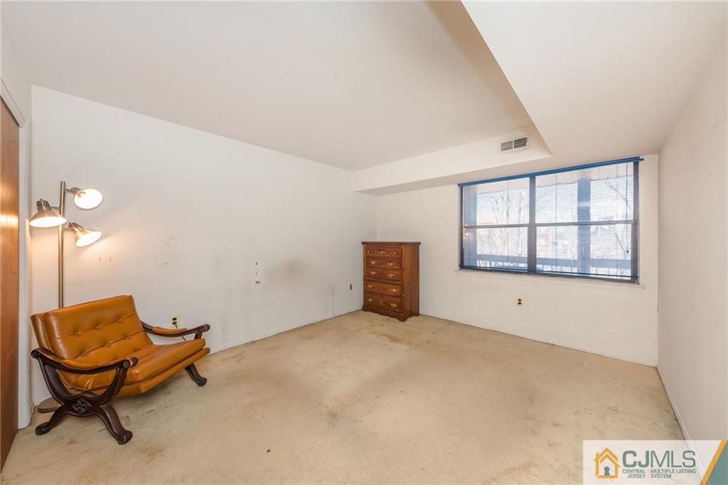 1915 Raspberry Court, Unit 1915 Edison, NJ 08817 - Photo 9 of 18 a view of an empty room with a window