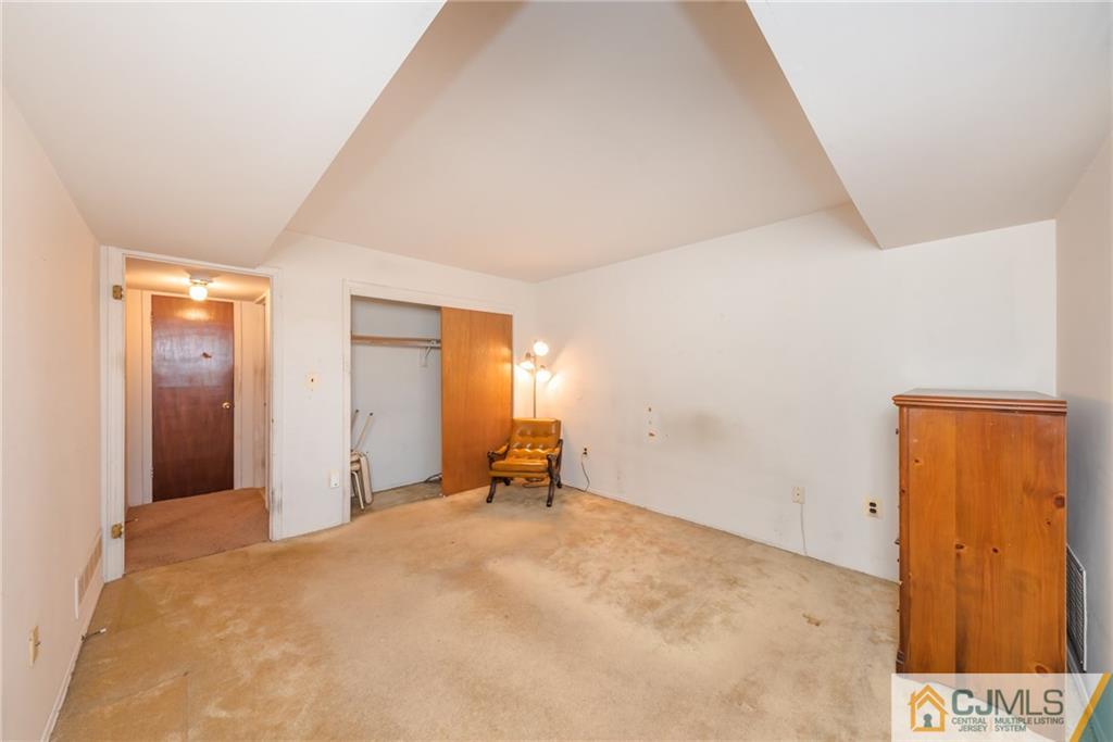 1915 Raspberry Court, Unit 1915 Edison, NJ 08817 - Photo 10 of 18 a view of a room with a hallway