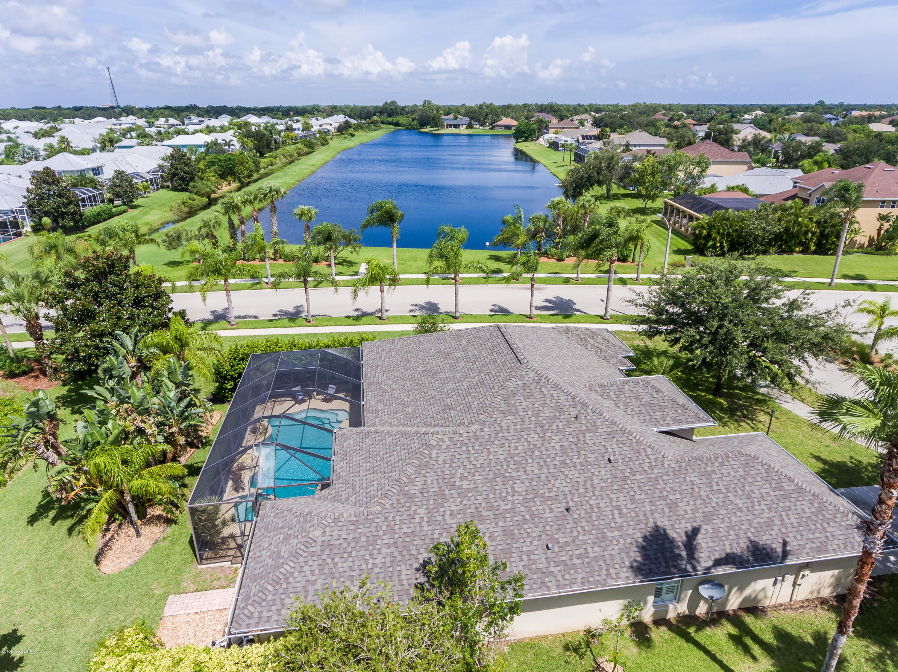 1602 Long Pine Road Melbourne, FL 32940 - Photo 2 of 28 an aerial view of a house with a garden and a yard
